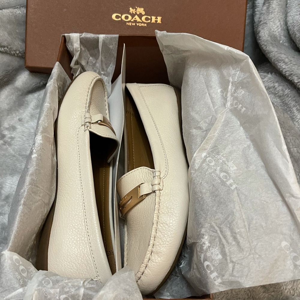 White and gold coach loafers